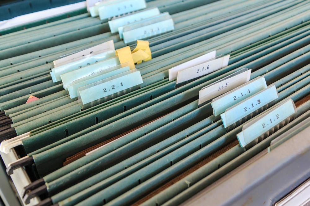 Organize files with filing cabinet